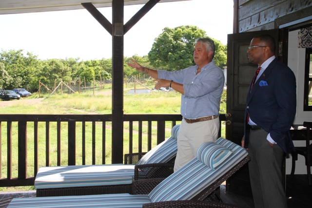 Deputy Premier and Minister of Tourism Hon. Mark Brantley tours the first completed unit at Paradise Palms with General Manager Jason Molle on September 23, 2015